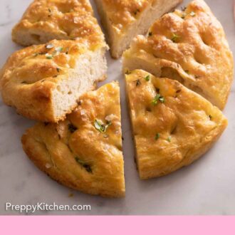 Pinterest graphic of a round focaccia cut into 6 wedges.