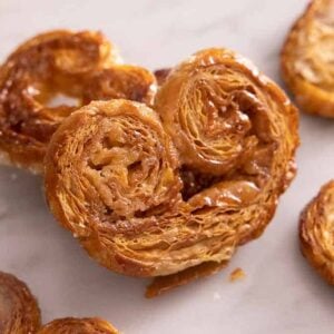 A palmier propped on top of another.
