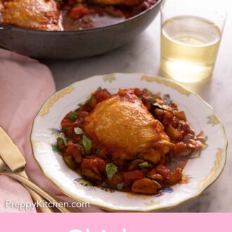 Pinterest graphic of a plate with a serving of chicken cacciatore in front of a glass of wine and a pan with the rest of the chicken.