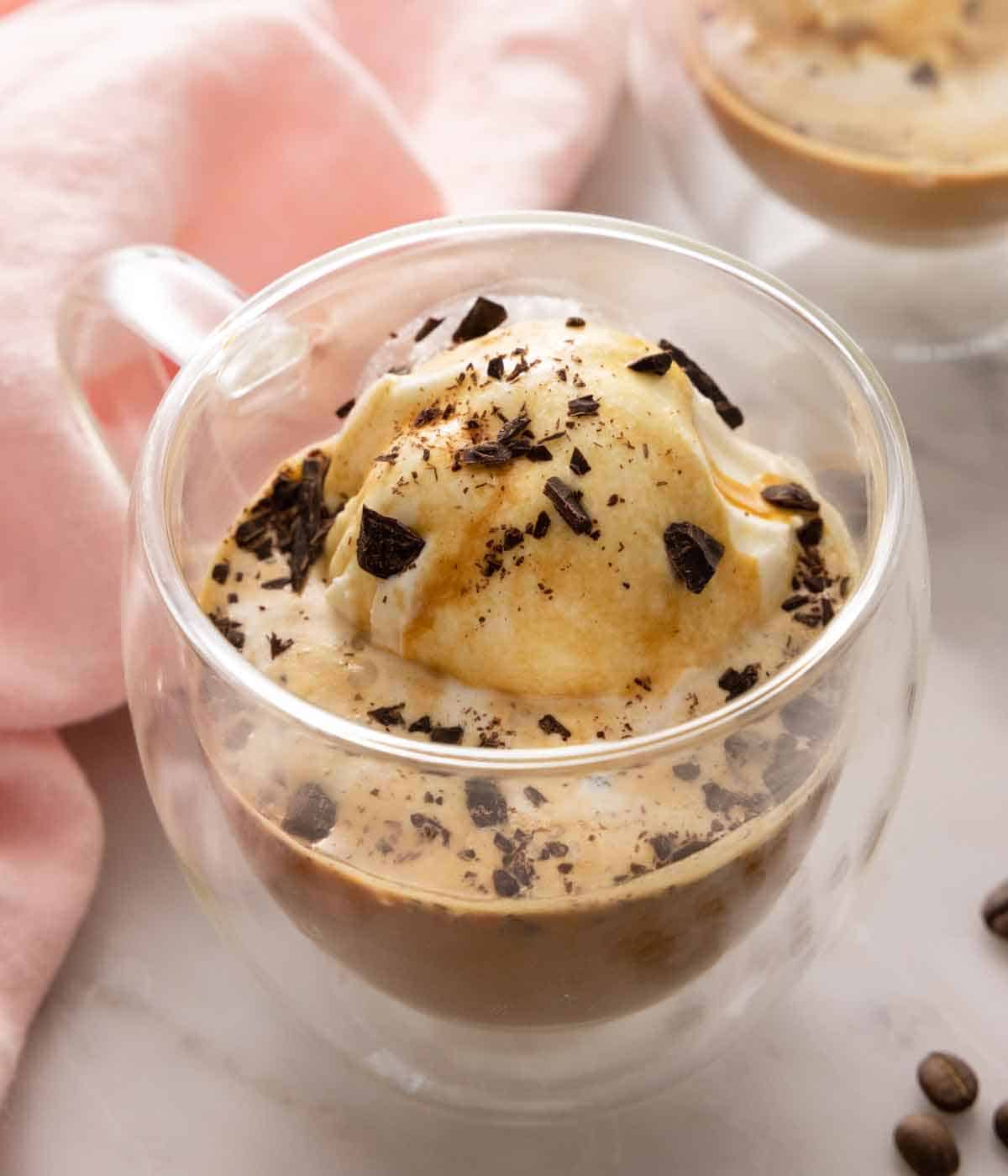 A cup of affogato with chocolate shavings on top.