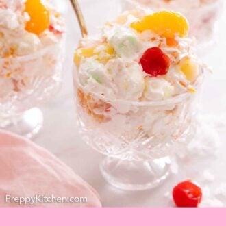 Pinterest graphic of three servings of ambrosia salads in glass cups, with one in focus in front.