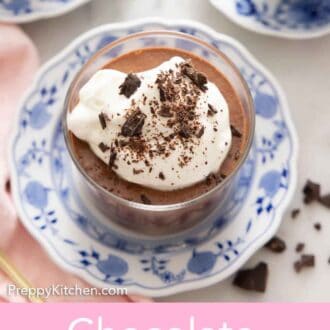 Pinterest graphic of an overhead view of a glass of chocolate mousse with whipped cream and shaved chocolate on top.