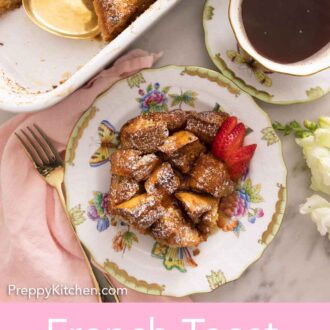 Pinterest graphic of the overhead view of a plate of French toast casserole by a cup of coffee and the rest of the casserole dish.