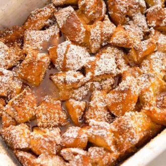 A white casserole dish containing French toast casserole.