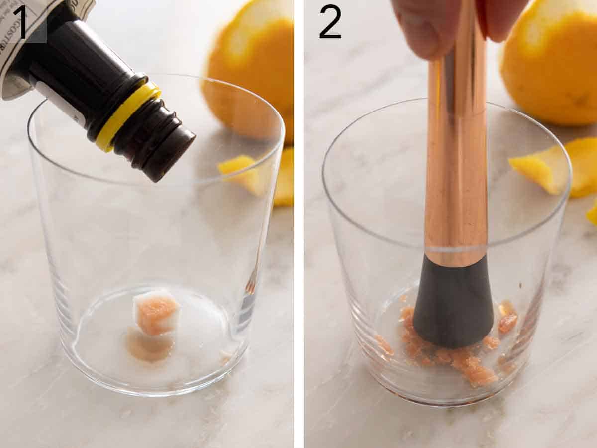 Set of two photos of a glass with a sugar cube with bitters poured on top then pressed down with a muddler.