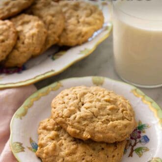 Pinterest graphic of a plate with two peanut butter oatmeal cookies in front of a glass of milk.