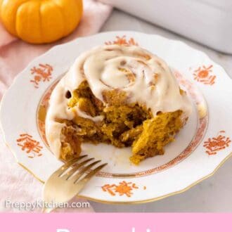 Pinterest graphic of a pumpkin cinnamon roll with a bite taken out of it.