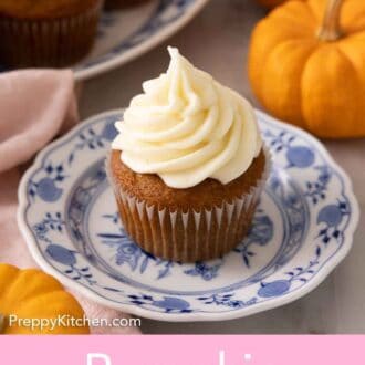 Pinterest graphic of a plate with a single pumpkin cupcake with cream cheese frosting on top.