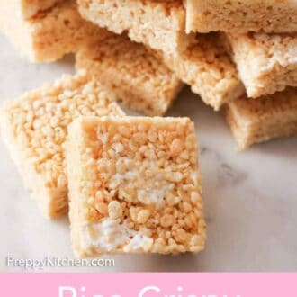 Pinterest graphic with a pile of rice crispy treats behind two squares, propped up.