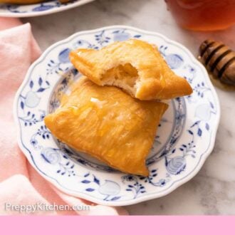 Pinterest graphic of a plate with two sopapillas with one with a bite taken out of it.