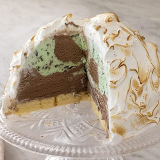 A baked Alaska with a slice cut out.