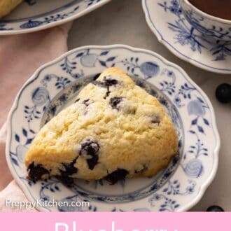 Pinterest graphic of a plate with a blueberry scone in front of a cup of tea.