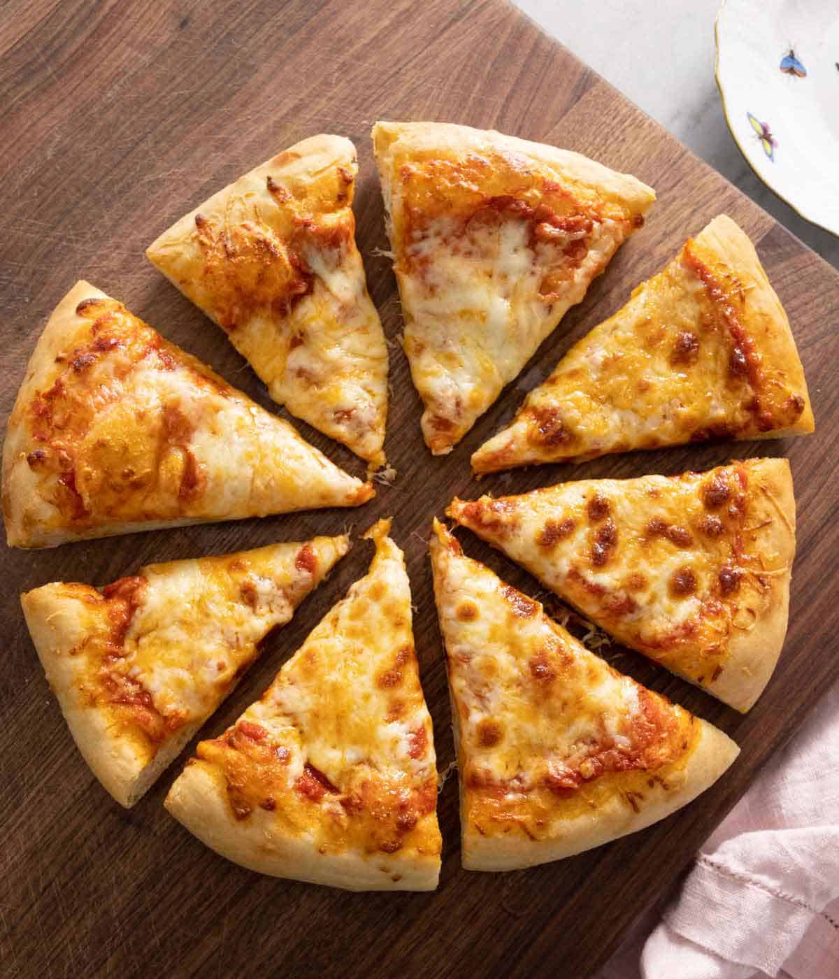 A cheese pizza cut into eight slices.