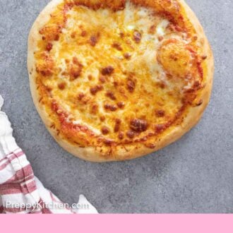 Pinterest graphic of the overhead view of a uncut cheese pizza.