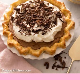 Pinterest graphic of a French silk pie in a pie dish and chocolate curls on top.