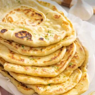 Pinterest graphic of a stack of naan bread.