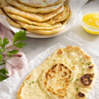Pinterest graphic of a naan bread in front of a stack in the back.