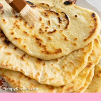 Pinterest graphic of butter being brushed onto a naan.