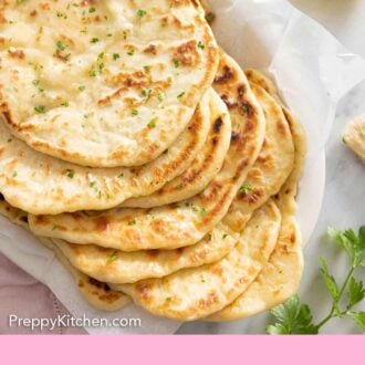 Pinterest graphic of a lined platter of naan breads.