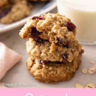 Pinterest graphic of a stack of three oatmeal cranberry cookies in front of milk.