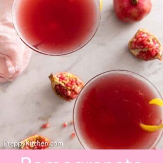 Pinterest graphic of the overhead view of two glasses of pomegranate martinis.