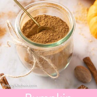 Pinterest graphic of a jar of pumpkin pie spice with a spoon inside.