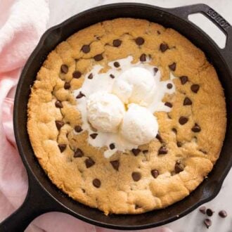 Overhead view of a skillet cookie with ice cream on top.