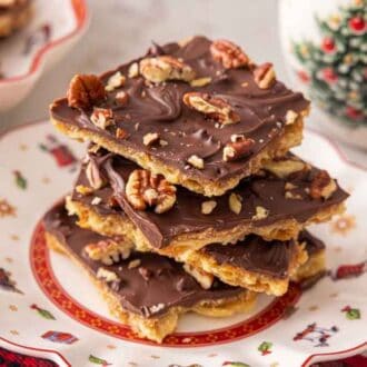 A stack of saltine cracker candy on a plate.
