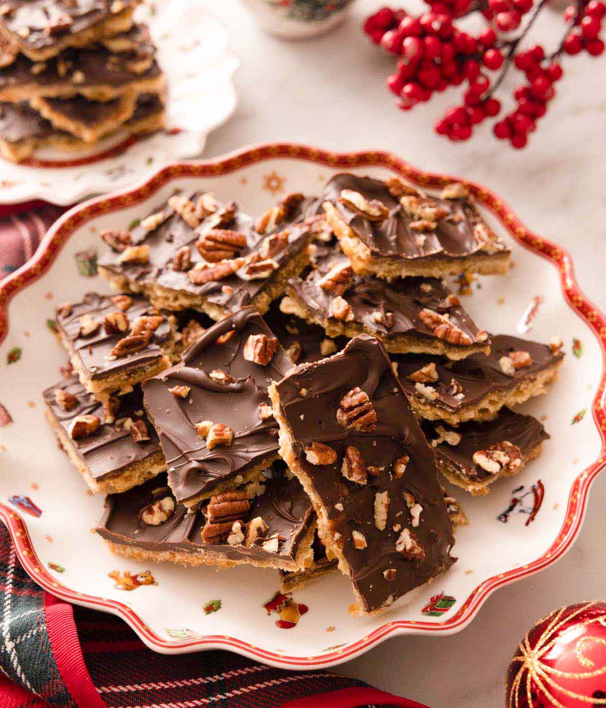 A festive plate with a pile of chocolate Christmas cracker candy.