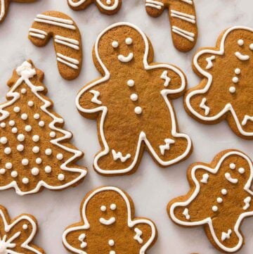 Gingerbread cookies in a shape of trees, people, candy canes, and snowflakes.