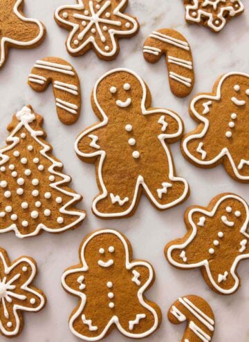 Gingerbread cookies in a shape of trees, people, candy canes, and snowflakes.