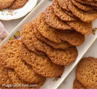 Pinterest graphic of a platter of multiple lace cookies.