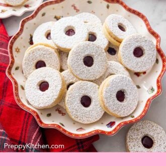 Pinterest graphic of a platter of linzer cookies.