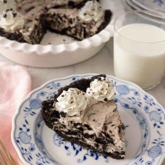 Pinterest graphic of a slice of Oreo pie on a plate in front of a glass of milk.