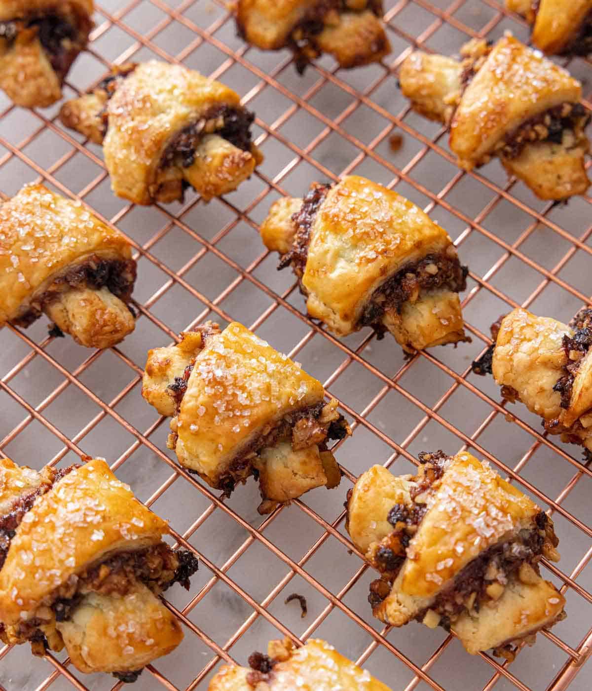 Multiple rugelach on a wire cooling rack.