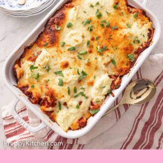 Pinterest graphic of baked ziti in a white casserole dish by a stack of plates and utensils.