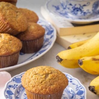 Pinterest graphic of a plate with a banana muffin by some more muffins and coffee.