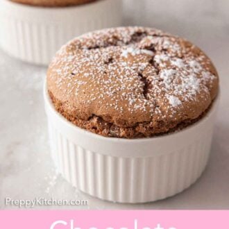 Pinterest graphic of a chocolate souffle in front of another with powdered sugar on top.