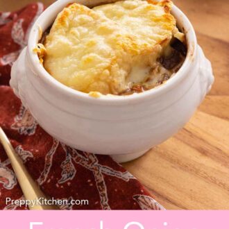 Pinterest graphic of a bowl of French onion soup with a red linen beside it.