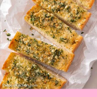 Pinterest graphic of a loaf of garlic bread, cut into rectangles.