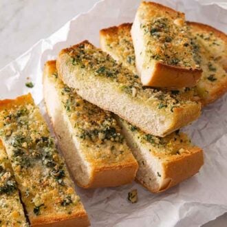 Cut pieces of garlic bread with two on top of the rest.