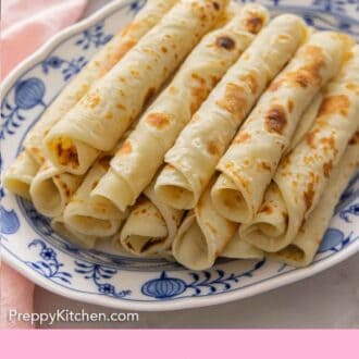 Pinterest graphic of a platter with rolled lefse.