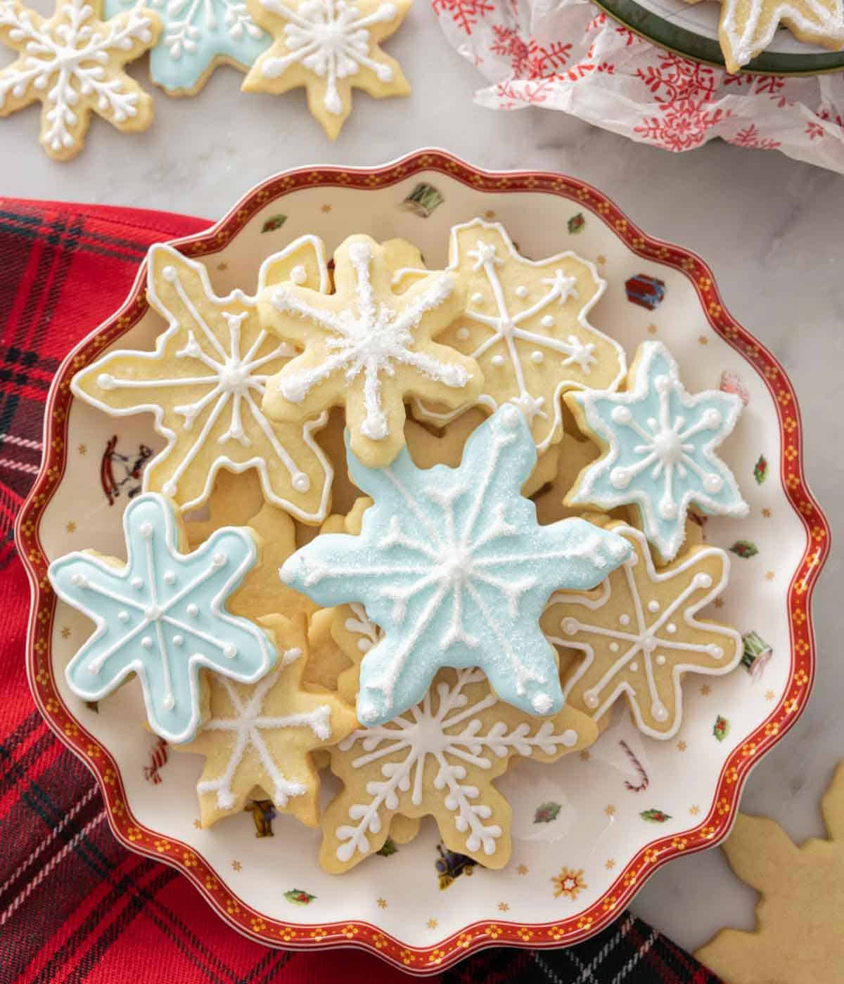 A bowl with multiple snowflake cookies.