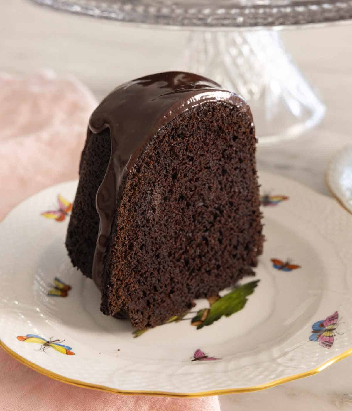 A slice of chocolate bundt cake on a plate.