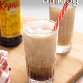 Pinterest graphic of a glass of Colorado Bulldog in focus with another glass and bottle of Kahlua in the background.
