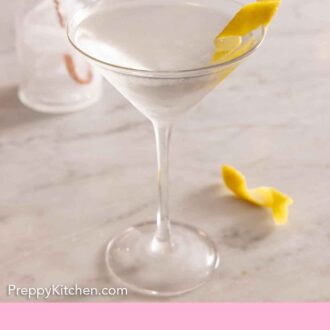 Pinterest graphic of a martini with a lemon garnish.