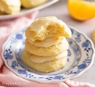 Pinterest graphic of a stack of three orange cookies with a bite taken out of the top cookie.