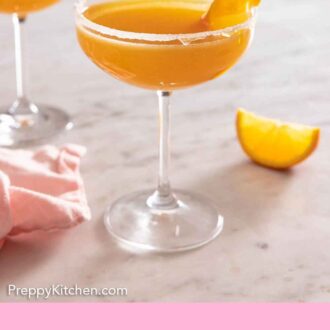 Pinterest graphic of a sidecar cocktail with an orange twist.