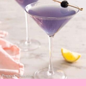 Pinterest graphic of two glasses of Aviation cocktails with cherry garnishes.