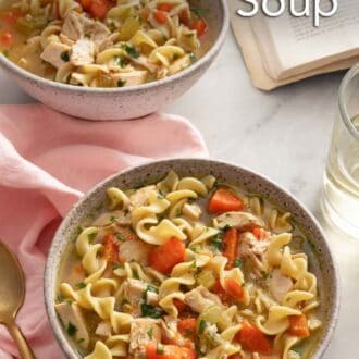 Pinterest graphic of two bowls of chicken noodle soup by a pink napkin and a spoon.